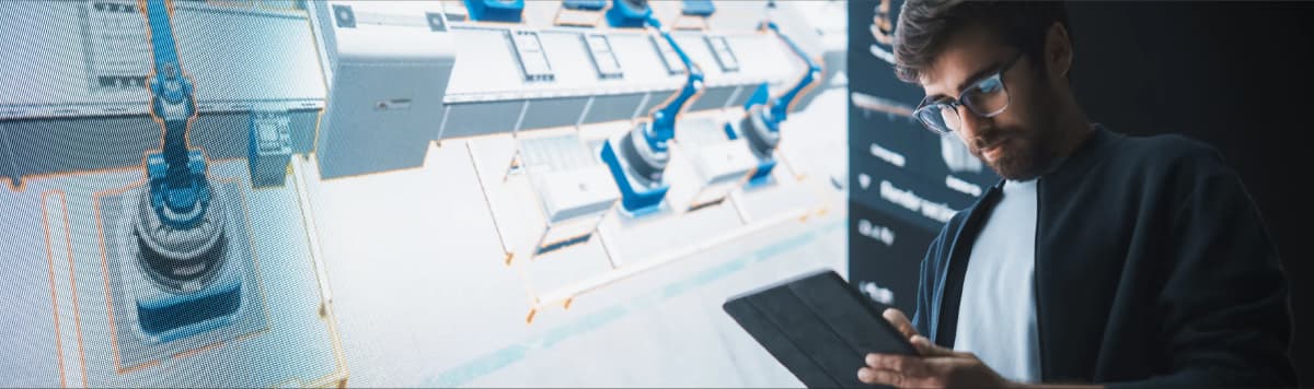 Professional reviewing industrial digital twin 3D model on tablet for factory layout planning and manufacturing optimization