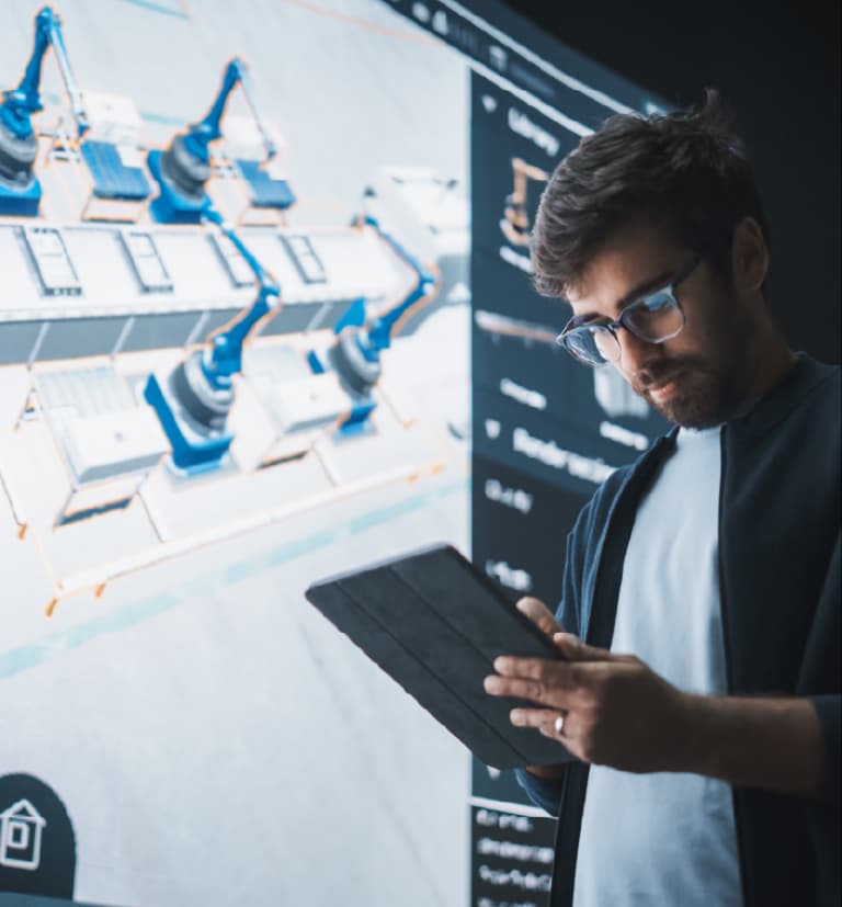 Professional reviewing industrial digital twin 3D model on tablet for factory layout planning and manufacturing optimization