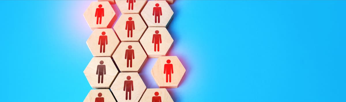 Red person icons on wooden hexagonal tiles representing organizational network structure and team collaboration hierarchy