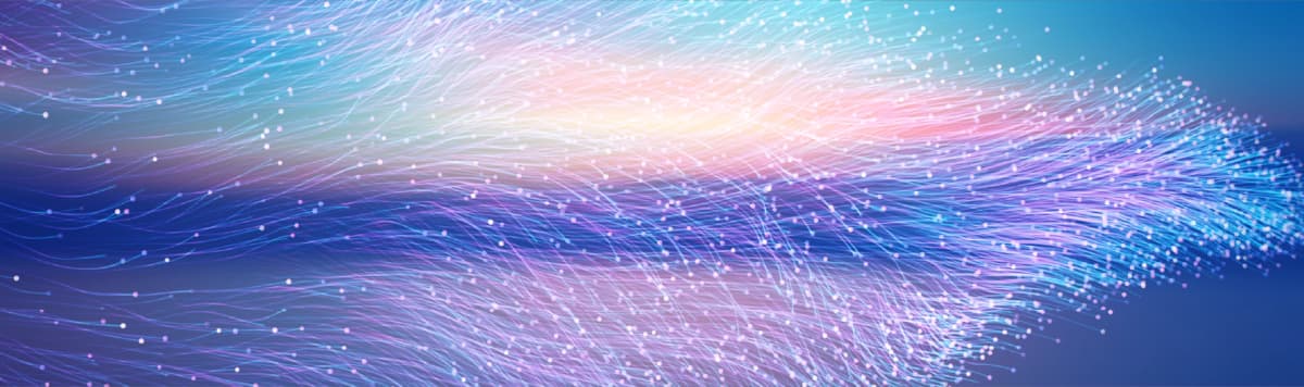 Colorful flowing fiber optic lines with glowing dots representing data flow network connectivity and digital technology