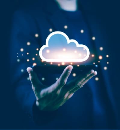 Hand holding a smartphone with a glowing cloud icon representing cloud computing and data storage