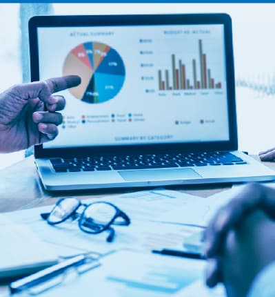Team reviewing business data and performance metrics on a digital analytics dashboard
