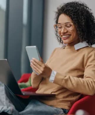 Person using laptop and phone