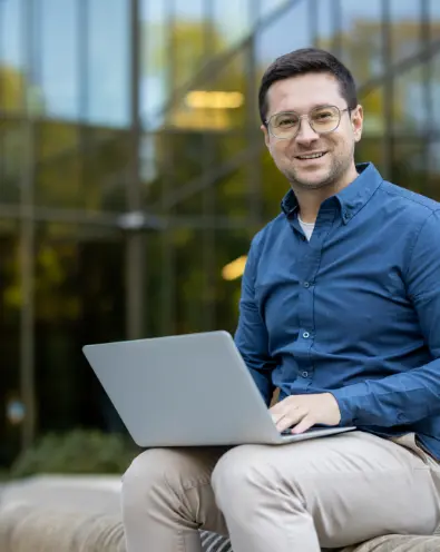 Smiling man with laptop