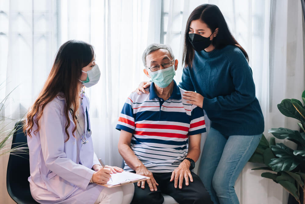 asian-doctor-visit-examines-senior-man-home-doctor-checking-up-consulting-retirement-health-partienthospital-services-wearing-mask-protect-covid19 (1)